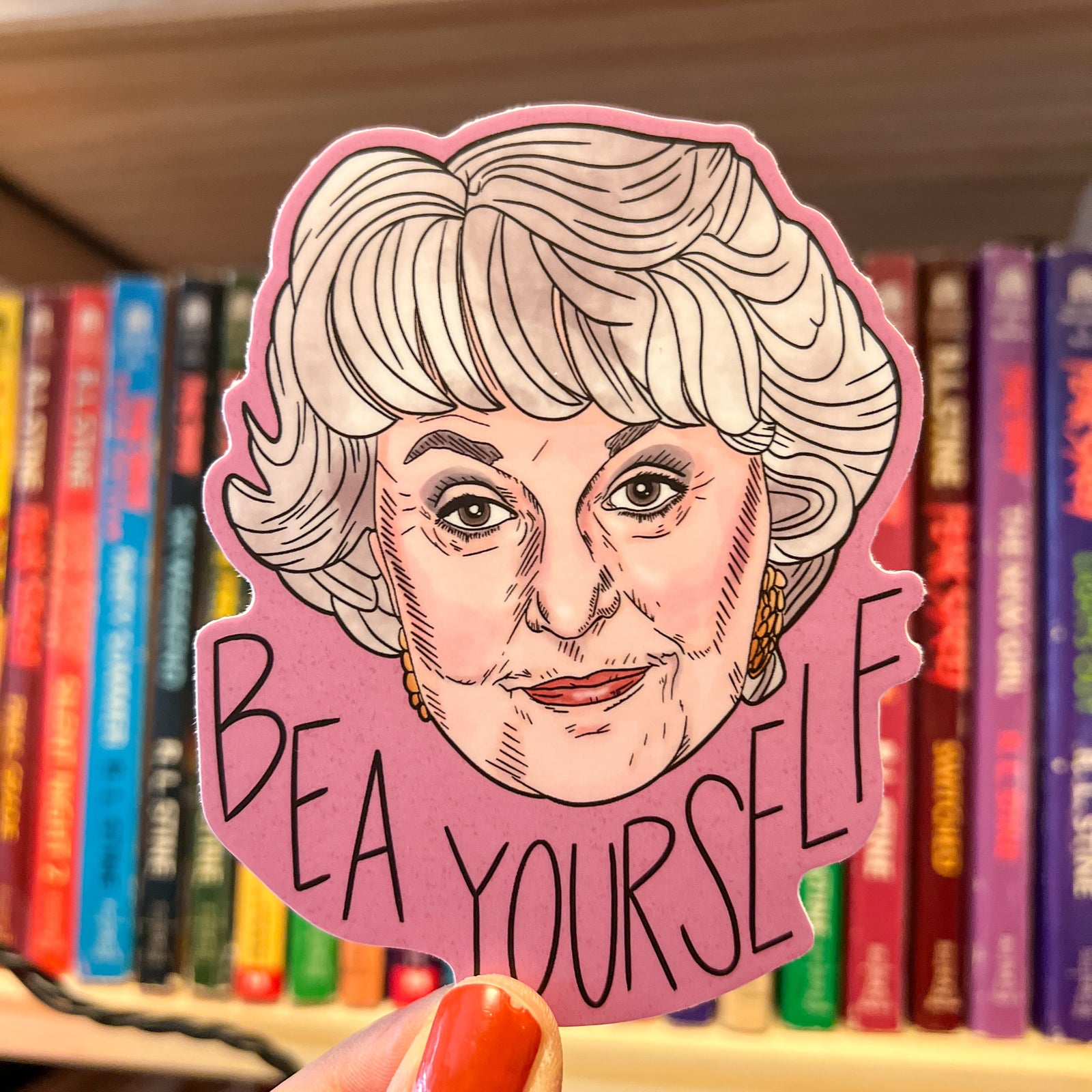 A sticker featuring an illustration of Bea Arthur. The caption reads Bea Yourself. I don't know about you, but I'm inspired. I'm also biased because I drew it, but whatever.