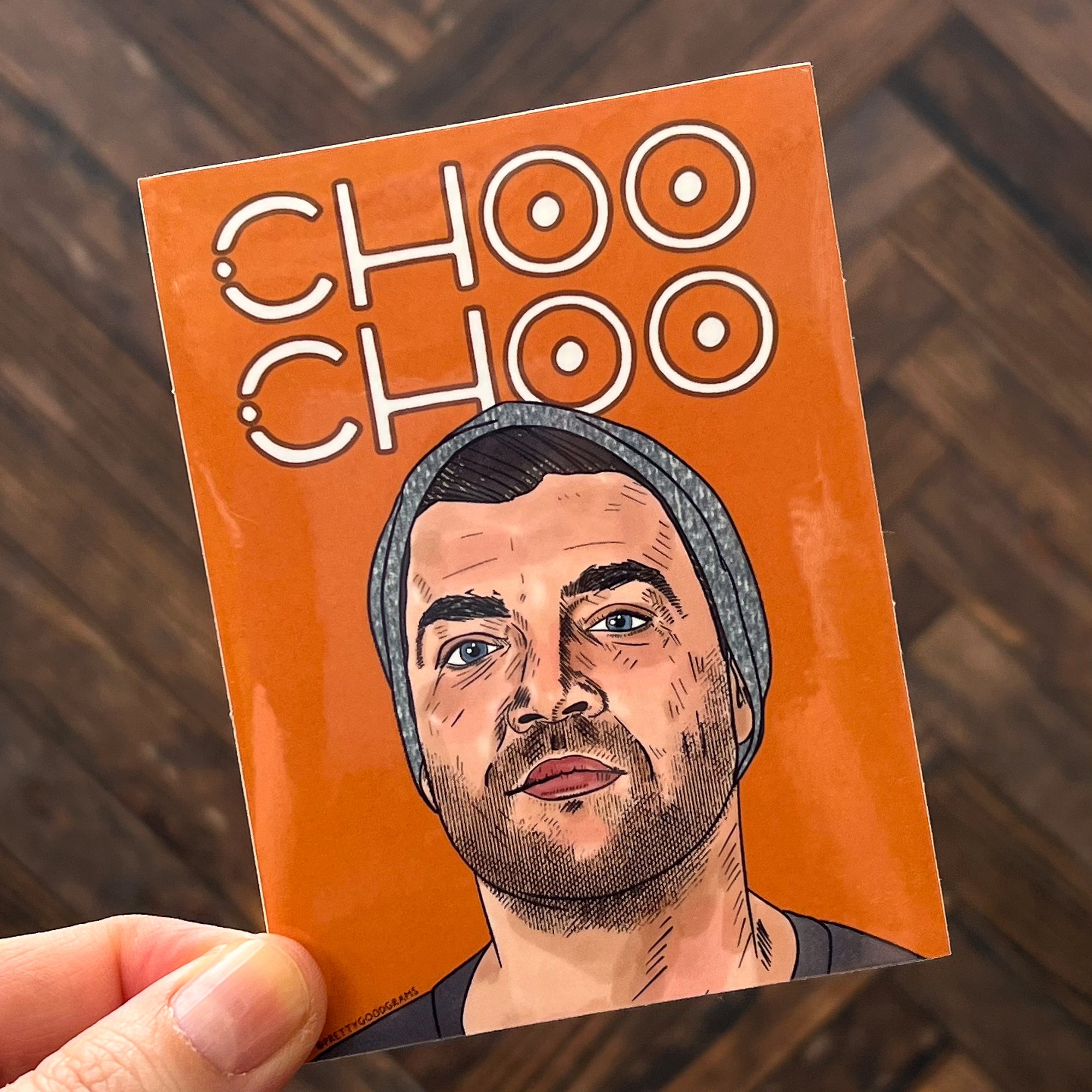 An orange, rectangular sticker featuring CT from The Challenge and the text "Choo Choo"