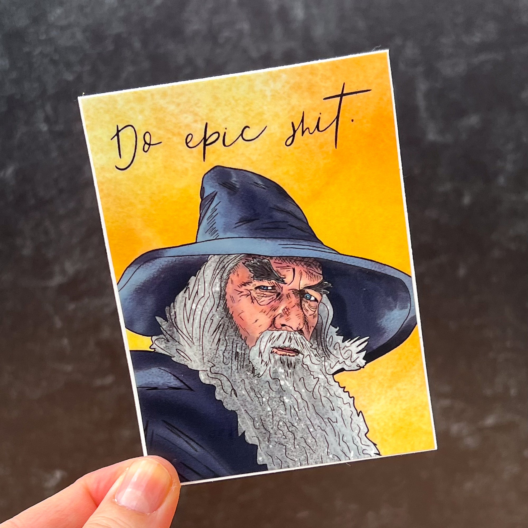 A motivational sticker that says "Do Epic Shit" and features an illustration of the Gandalf that is surprisingly detailed if we're being honest here.