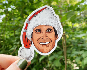 A bright portrait illustration of Clark from Christmas Vacation in sticker form